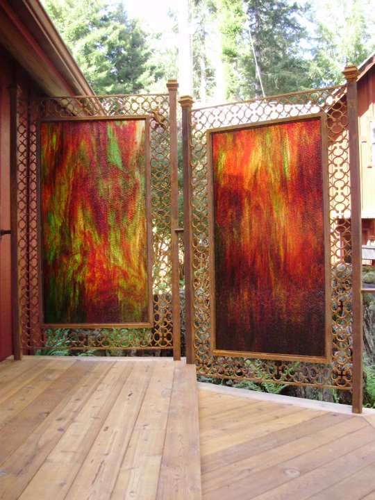 Custom decorative art panel installation on a redwood deck